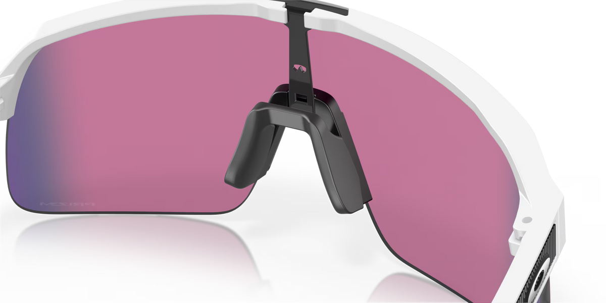 Oakley Sutro Lite Matte White Prizm Road sunglasses, three-quarter interior view showing the white frame and nose pads.