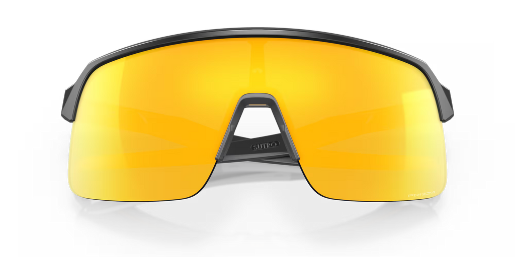 Oakley Sutro Lite Matte Carbon Prizm 24K sports sunglasses, front view with crossed carbon-grey temples visible through the gold lenses.