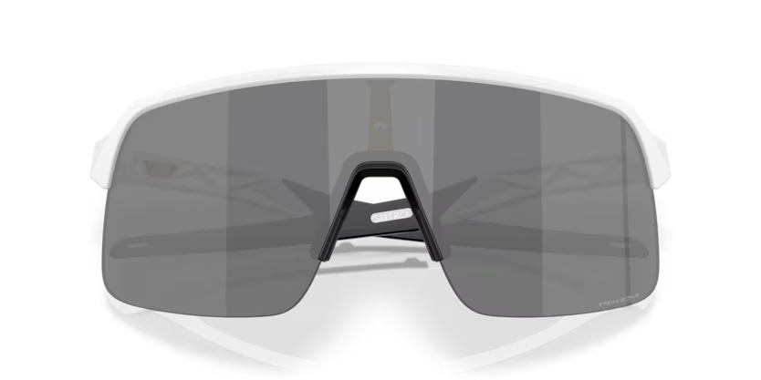 Oakley Sutro Lite Matte White Prizm Black sports sunglasses, front view with crossed white temples visible through the dark lenses.