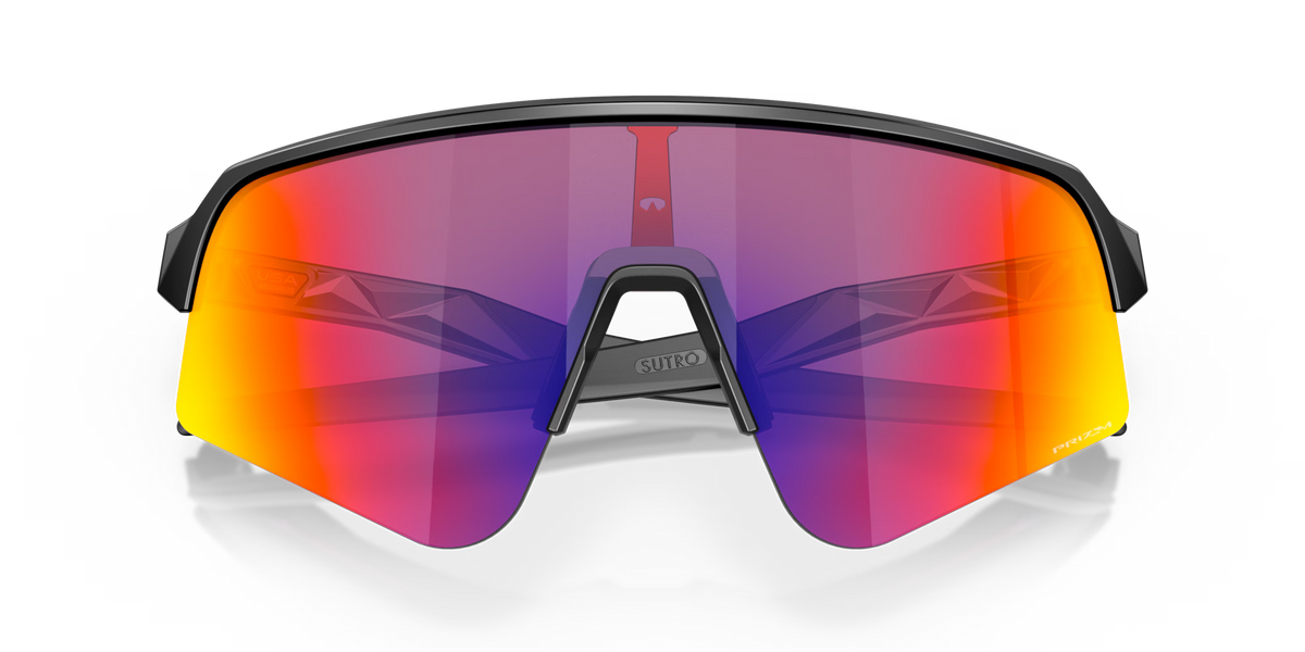 Oakley Sutro Lite Sweep Matte Black Prizm Road sports sunglasses, front view with crossed black temples visible through the lenses.