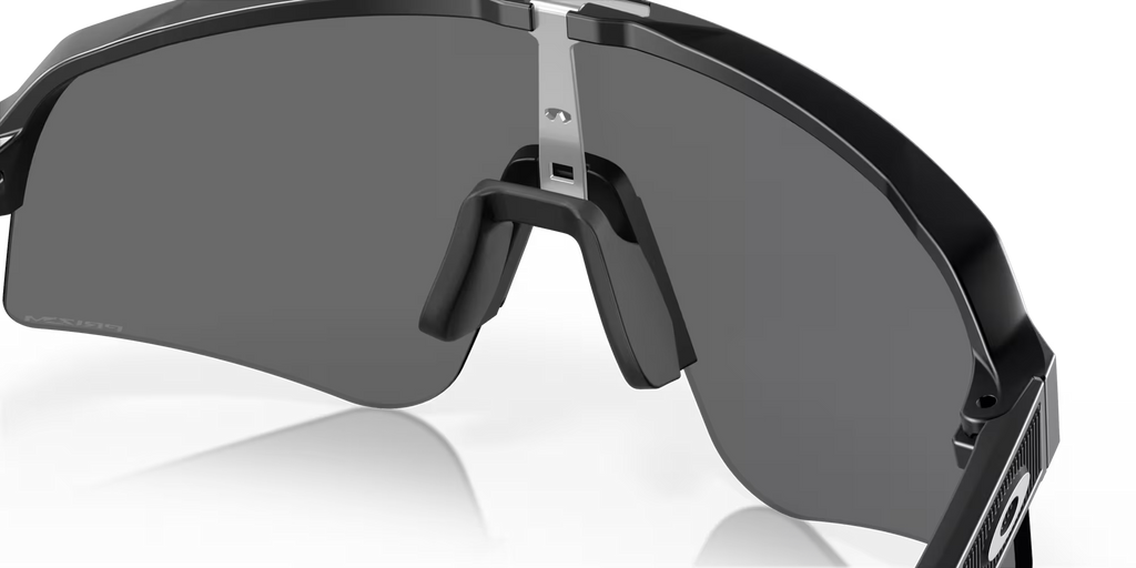 Oakley Sutro Lite Sweep Matte Black Prizm Black sunglasses, three-quarter interior view showing the black frame and nose pads.
