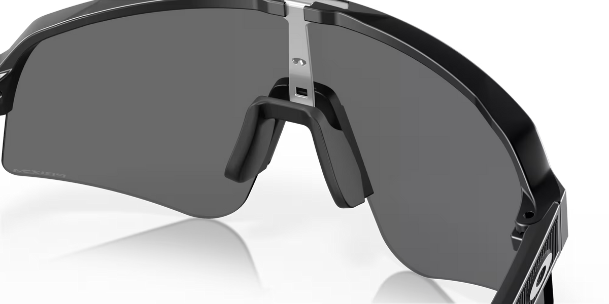 Oakley Sutro Lite Sweep Matte Black Prizm Black sunglasses, three-quarter interior view showing the black frame and nose pads.