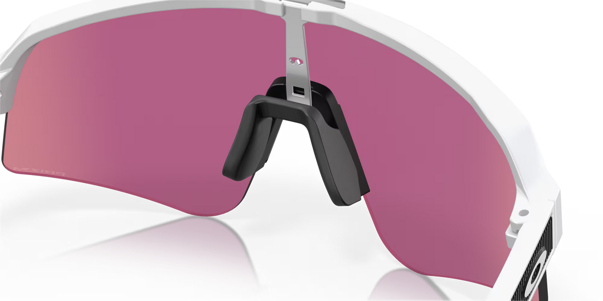 Oakley Sutro Lite Sweep Matte White Prizm Road Jade sunglasses, three-quarter interior view showing the white frame and nose pads.