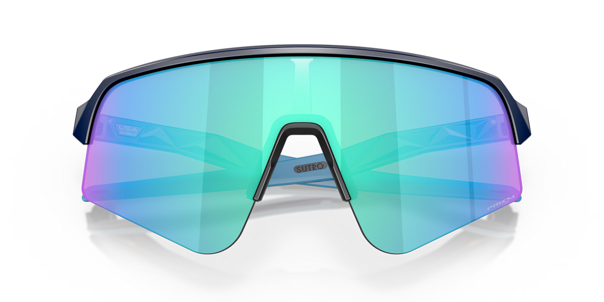 Oakley Sutro Lite Sweep Matte Navy Prizm Sapphire sports sunglasses, front view with crossed navy temples visible through the blue lenses.