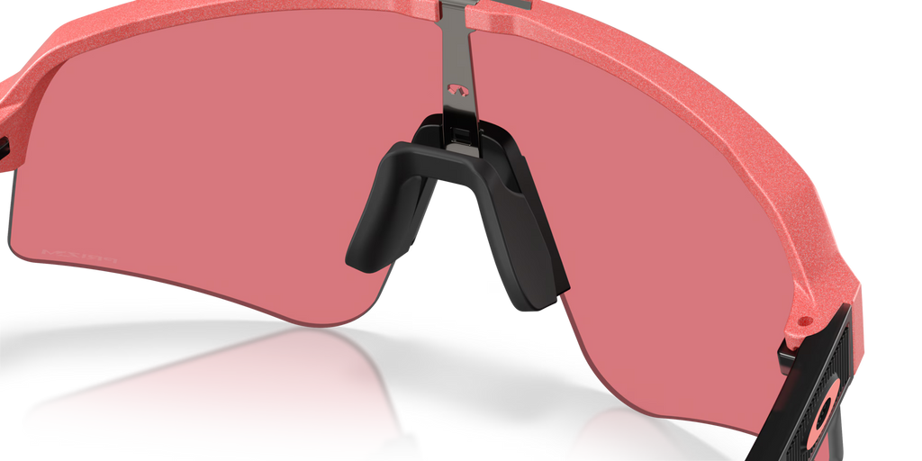 Oakley Sutro Lite Sweep Muted Metallic Paloma Prizm Trail Torch sunglasses, three-quarter interior view showing the metallic-toned frame and nose pads.